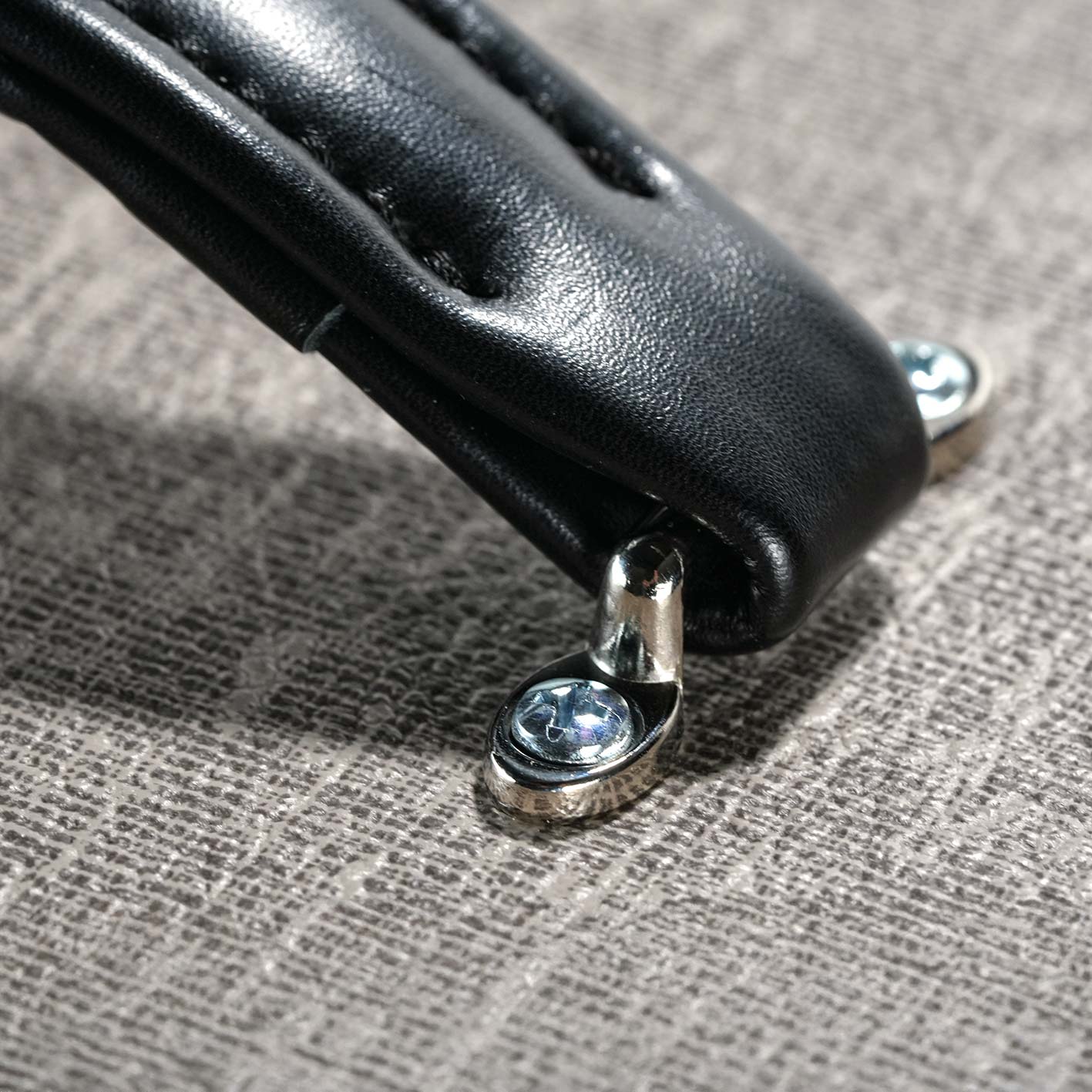 RedSeven Azary leather handle detail on Italian handcrafted linen tolex