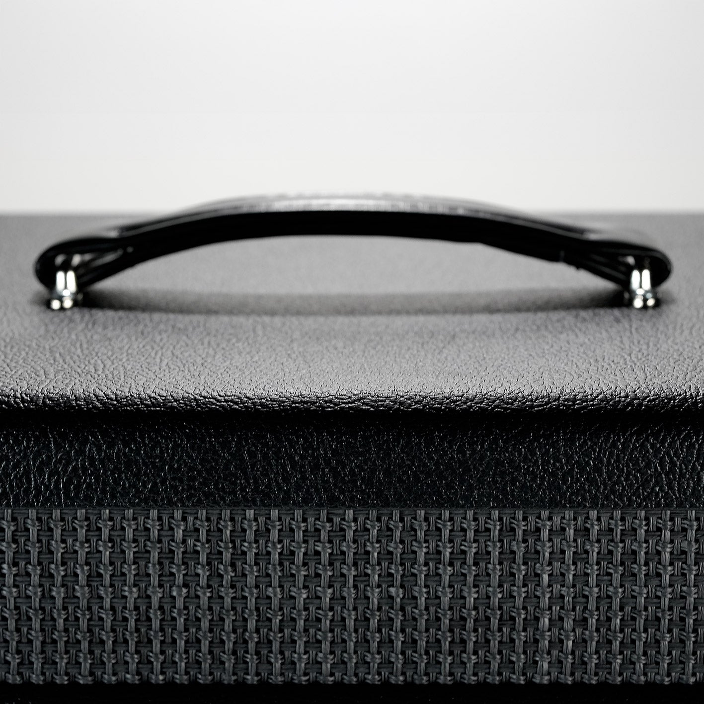 Top handle of the RedSeven guitar cabinet with textured tolex finish