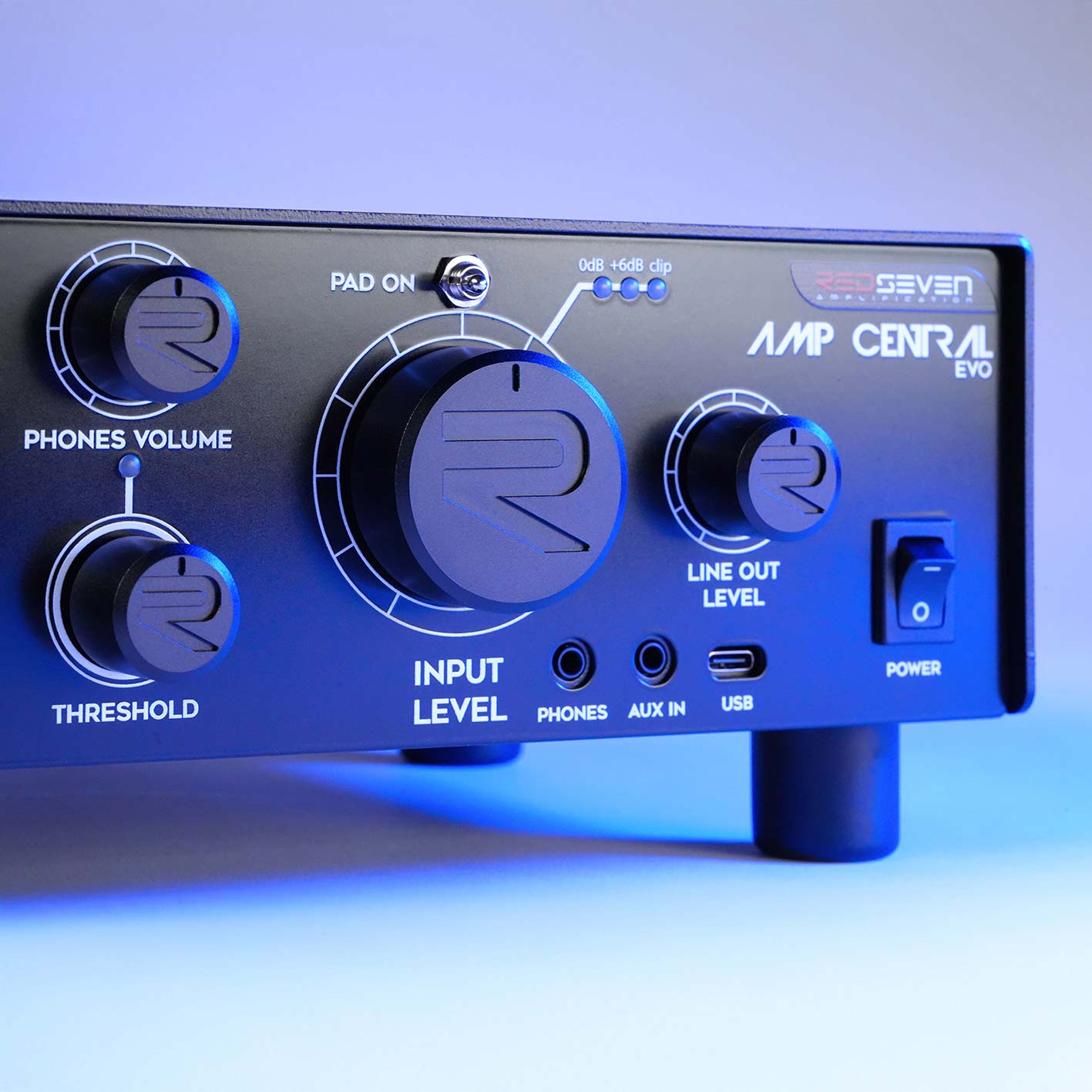 Macro close-up of the RedSeven Amp Central EVO main input level knob and RedSeven logo