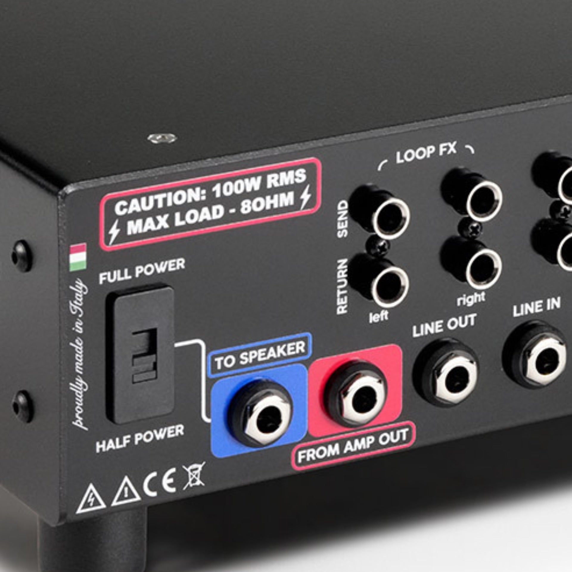 Close-up of the RedSeven Amp Central EVO rear panel showing speaker output, line in, line out, and power selector