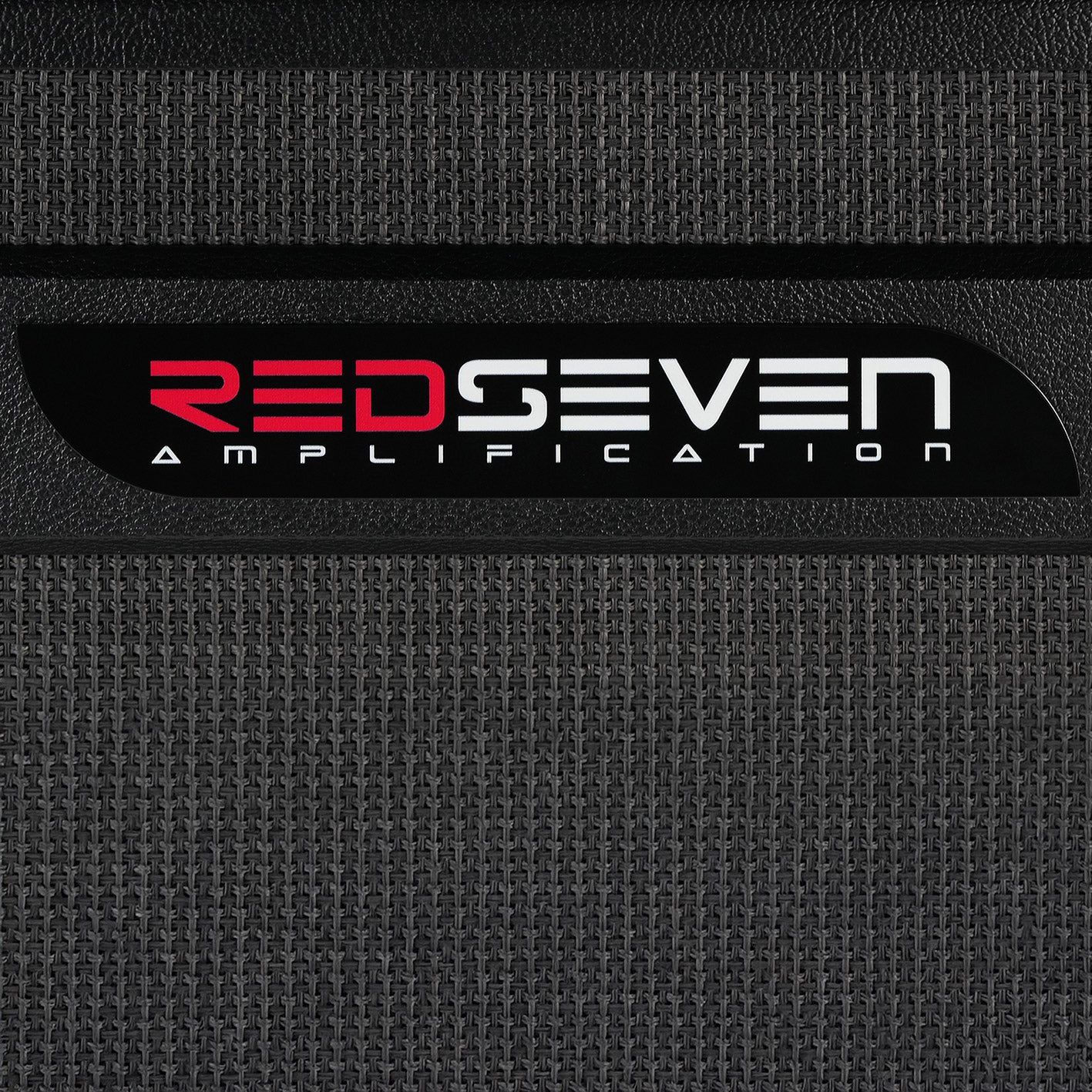 Close-up of RedSeven Amplification logo on cabinet front panel