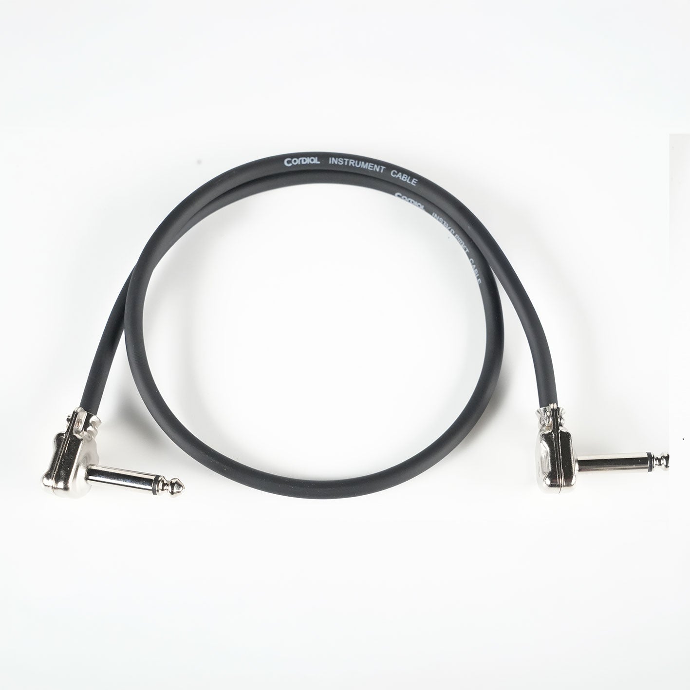 RedSeven x Cordial PATCH CABLES, right angle guitar pedalboard patch cable on white background