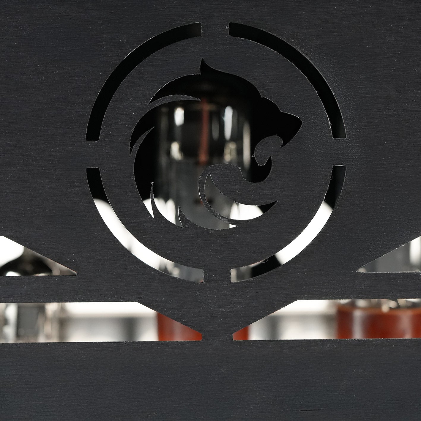 Rear panel detail of the RedSeven Duality amplifier with cutout logo and tubes visible