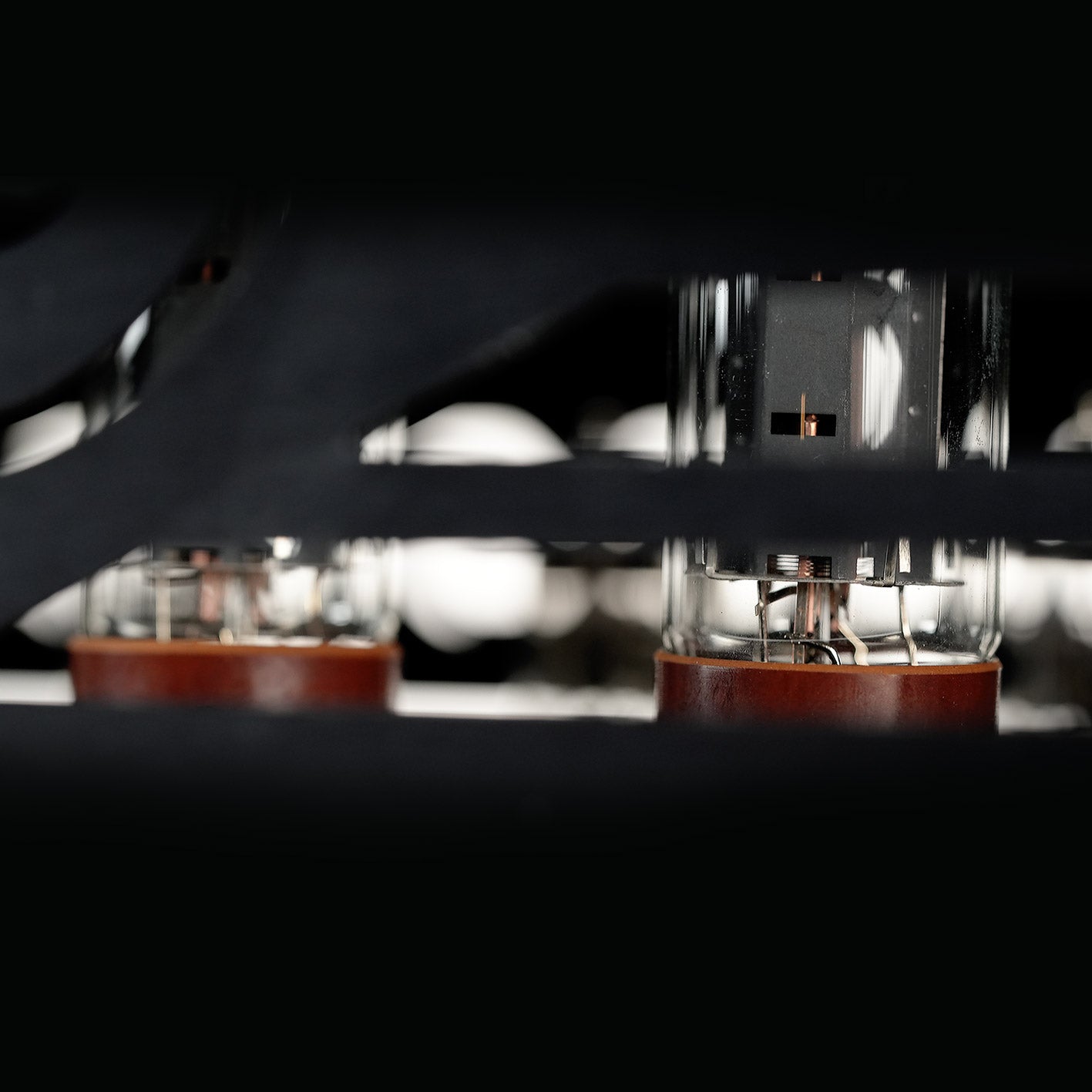 Close-up view of the vacuum tubes inside the RedSeven Duality amp seen through the vent