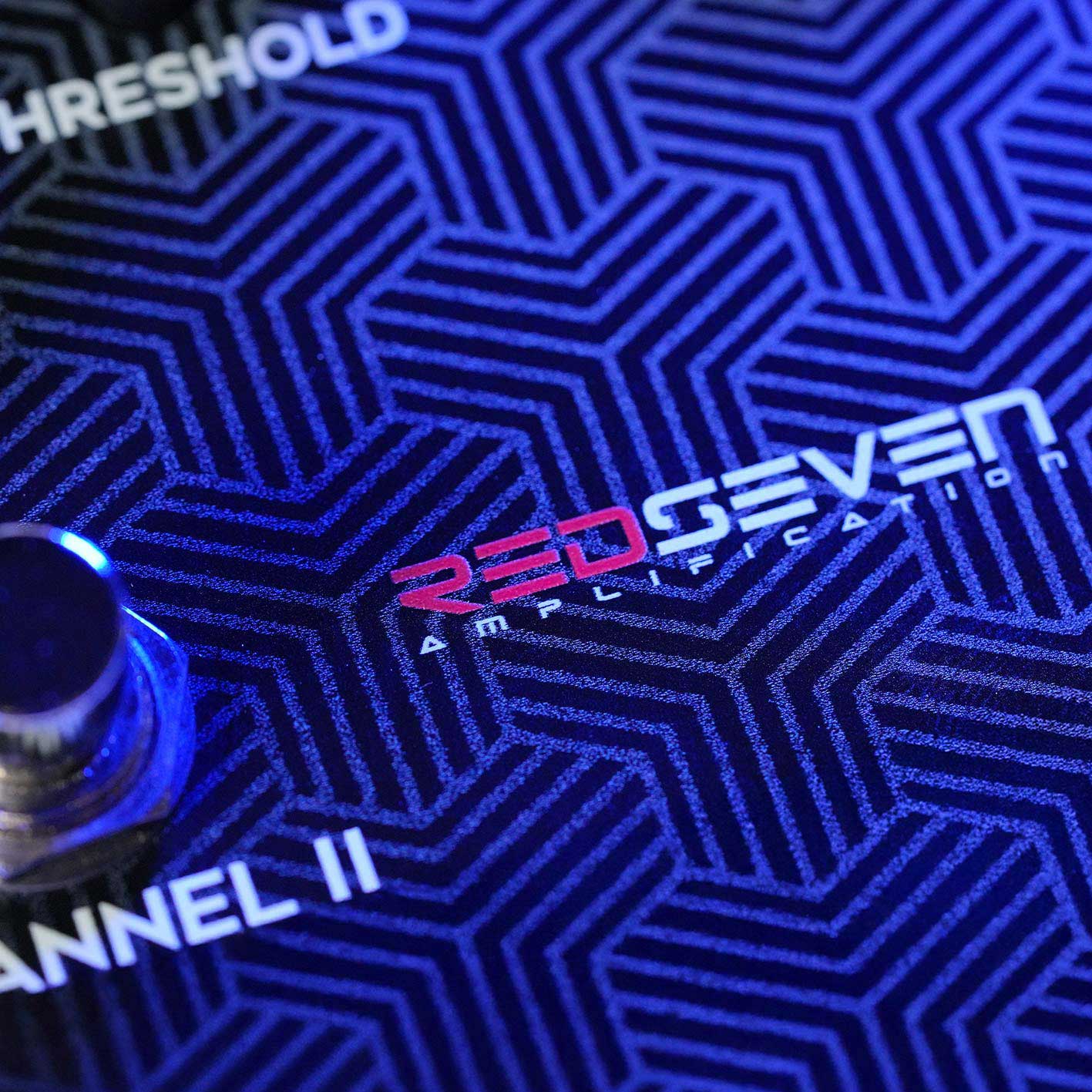 Close-up of the RedSeven Amplification logo on the Leviathan guitar tube preamp pedal