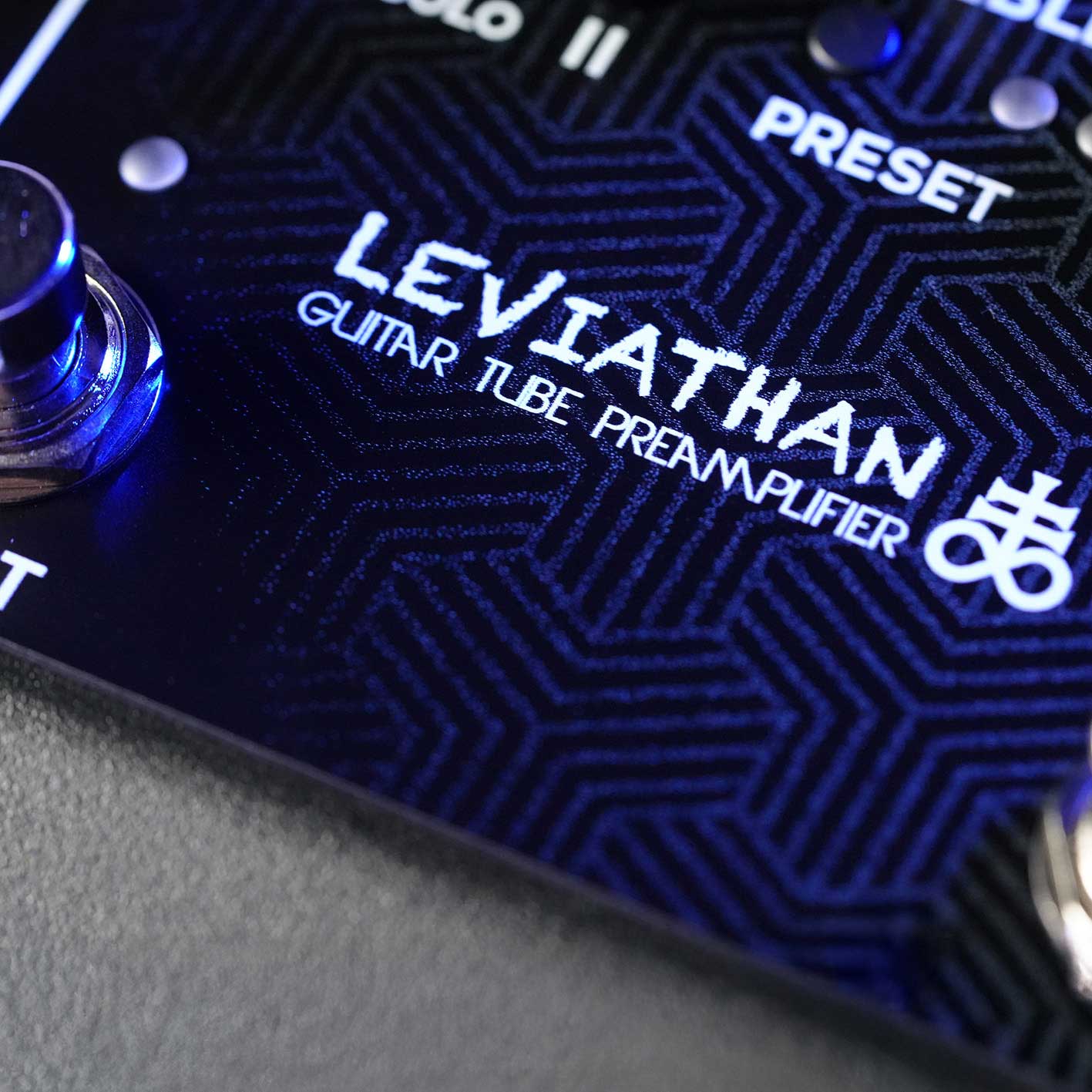 Close-up of the Leviathan guitar tube preamp pedal by RedSeven Amplification showing the logo and geometric pattern