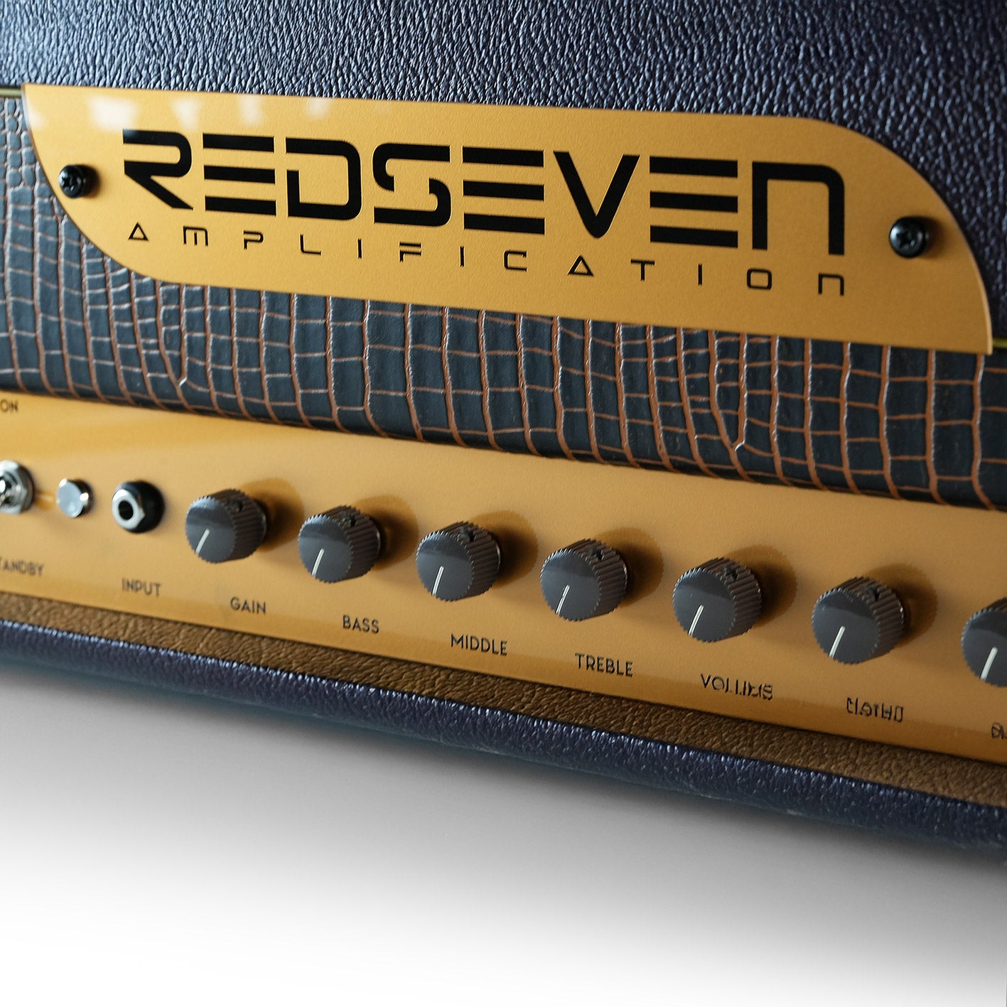 RedSeven Numero Uno front logo and EQ knobs, close up