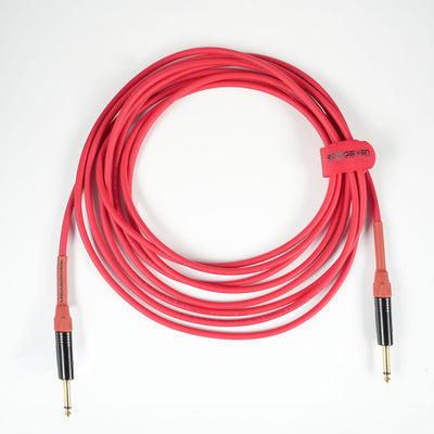 Master Signature instrument cable, RedSeven x Cordial, straight to straight 1,4 inch jacks, coiled cable on white background